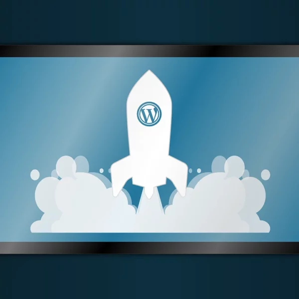 A tablet shows a rocket taking off, with the WordPress logo on the rocket.